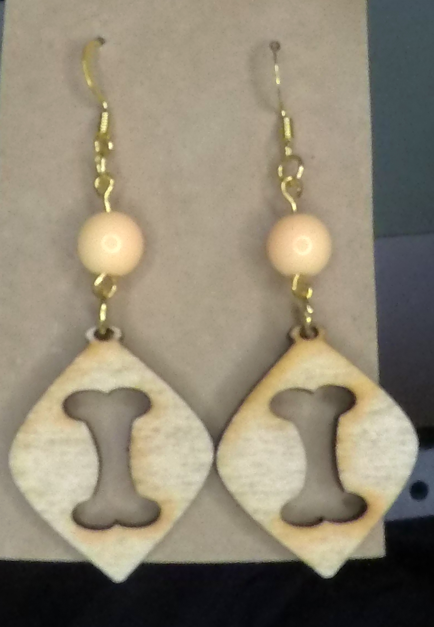 Bone Silhouette w/Cream Beads Wooden Earrings